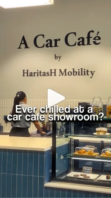 AutoThrust reel filmed at a car café showroom